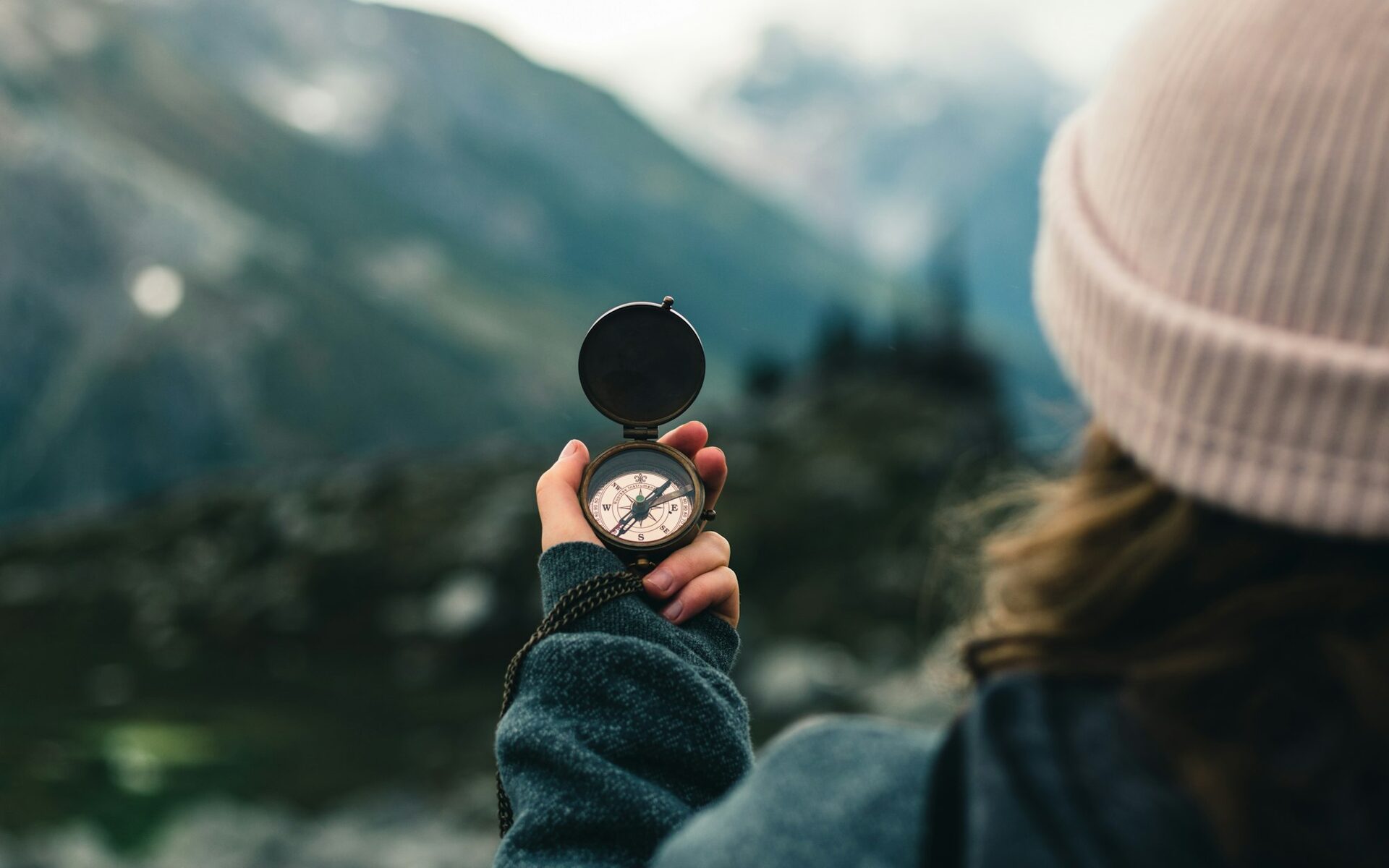 A compass held toward the mountains